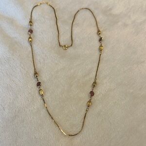 Elegant Gold tone, and amethyst glass stone Necklace. Made in Korea.